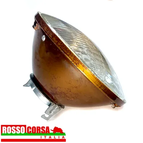 Central front headlight Fulvia 1st series. Original Carello, used in excellent condition. Lateral view of the headlight